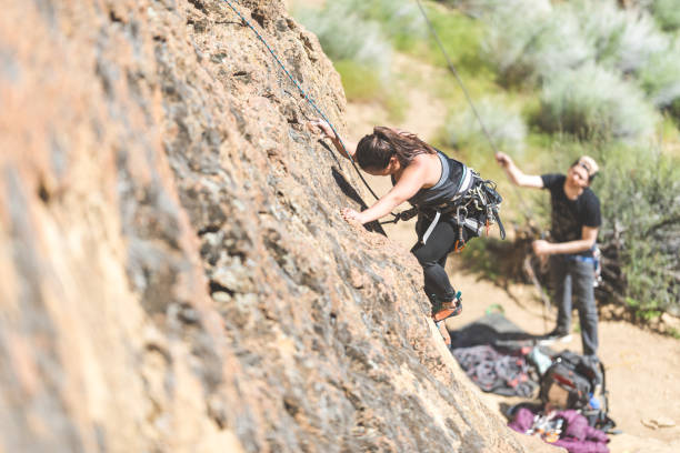 istock Young woman climbing a rock face in Oregon 981901920