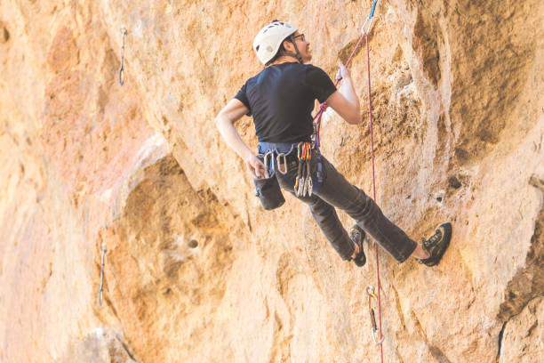 istock Man climbing a rock face in Oregon 981902000