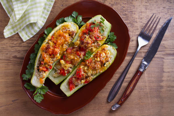 istock Zucchini stuffed with meat, vegetables and cheese. Zucchini boats 981925752