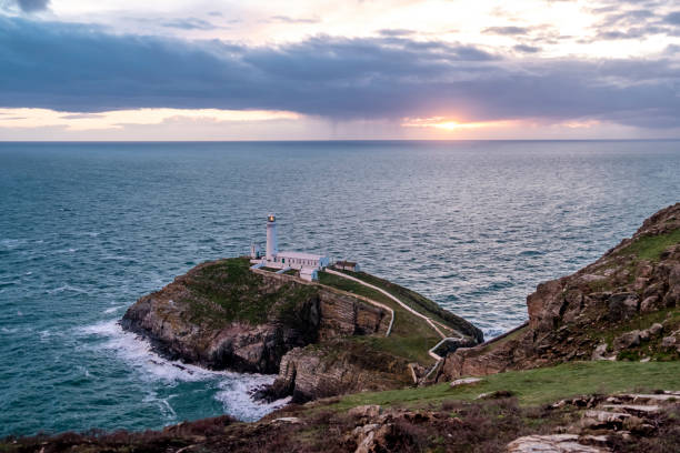 istock Dramatic sky above the historic South Stack Lighthouse - Isle of Anglesey North wales UK 981936700