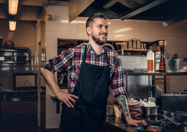 istock Portrait of master chef in a kitchen. 981977236
