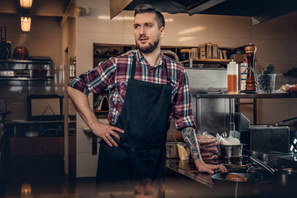 istock Portrait of stylish cook on a kitchen. 981981680