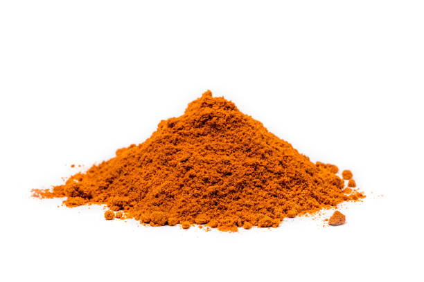 istock Pile of cayenne pepper on white 981982088