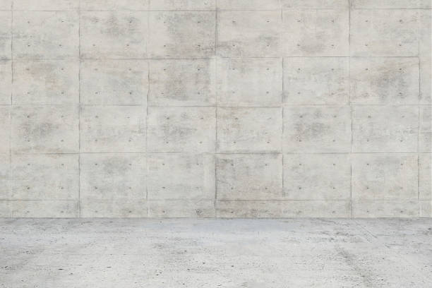 istock Abstract interior of empty room with concrete wall and floor 981990840