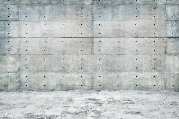 istock Abstract interior of empty room with concrete wall and floor 981990874