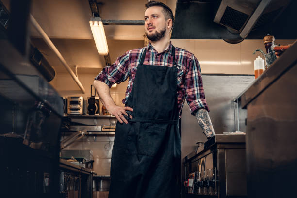 istock Portrait of stylish cook on a kitchen. 981991770