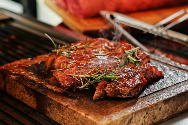 istock The grilled beef steak on a wooden board. 981992462