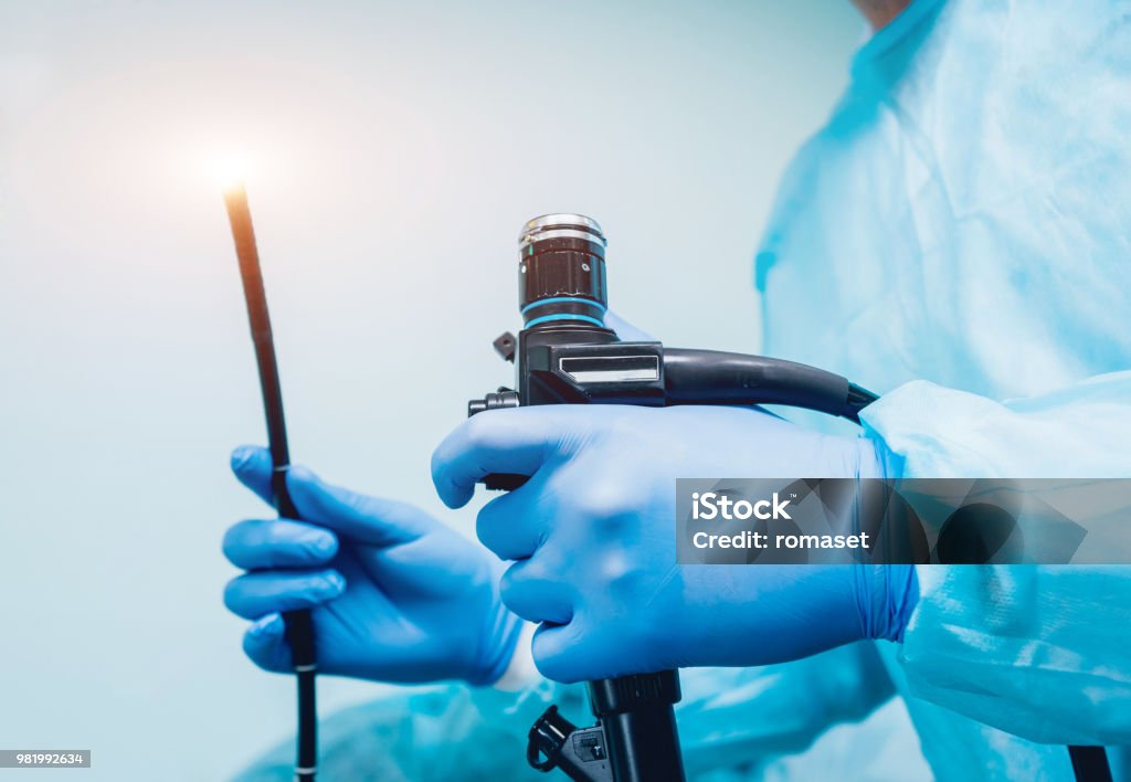 Endoscopy at the hospital. Doctor holding endoscope before gastroscopy Endoscopy at the hospital. Doctor holding endoscope before gastroscopy. Medical examination Endoscope Stock Photo