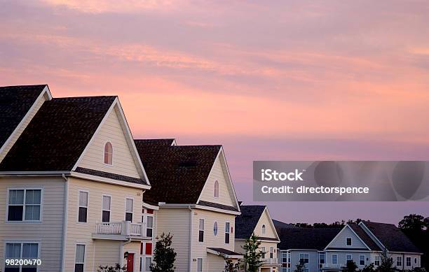 Pink Cloud Sunset Over Townhouse Rooftops Stock Photo - Download Image Now - Apartment, Balcony, Color Image