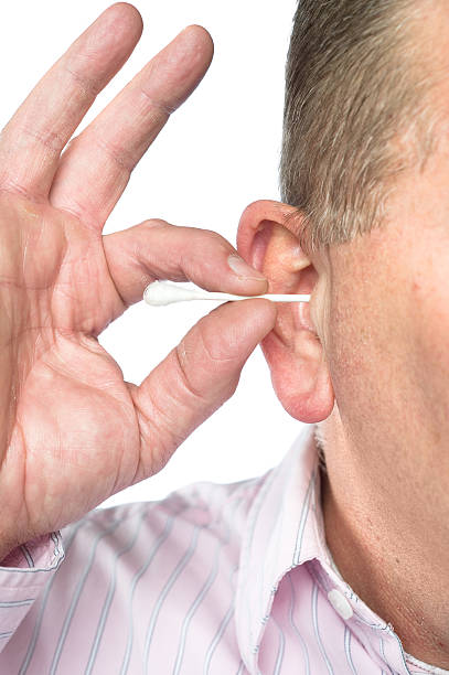 istock Man cleaning ear with cotton swab 98201098