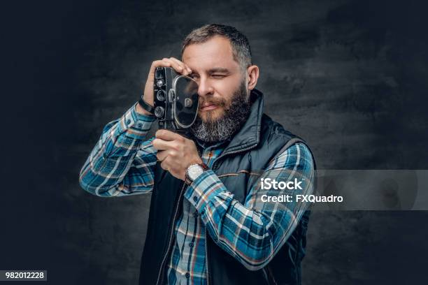 Bearded Middle Age Male Holds Vintage 8 Mm Video Camera Stock Photo - Download Image Now