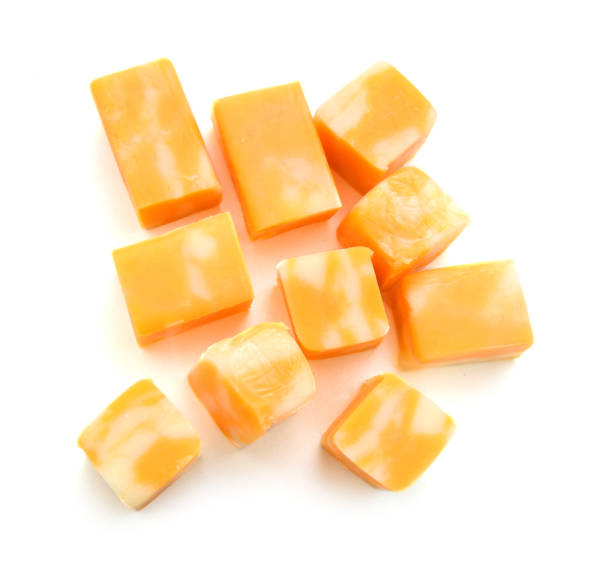 Cubes of Colby Cheese isolated on white Cubes of Colby Cheese isolated on white colby cheddar stock pictures, royalty-free photos & images