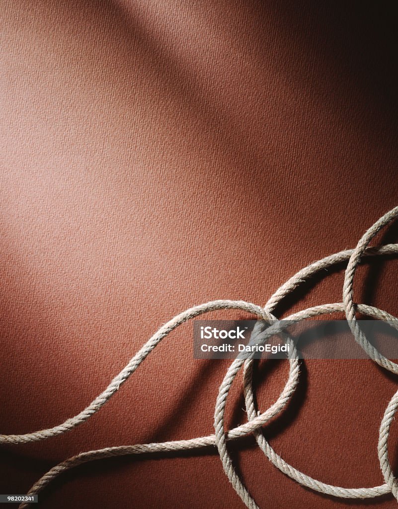 Corda naturale su Sfondo marrone - Foto stock royalty-free di Composizione verticale