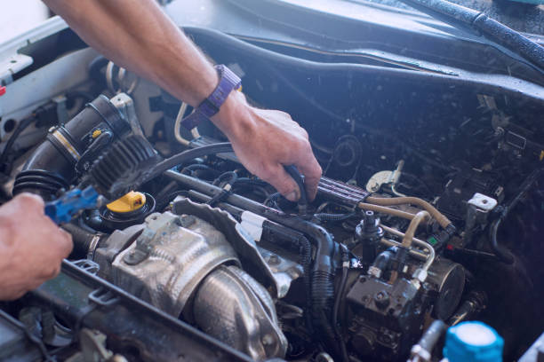 istock Auto mechanic repairing car. Selective focus. 982032054