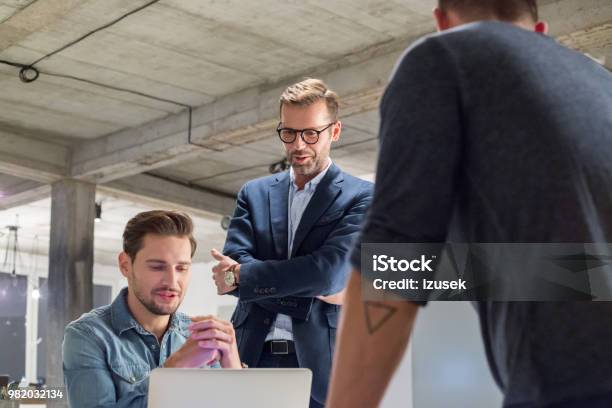 Team Of Professional Discussing Work In Office Stock Photo - Download Image Now - Adult, Adults Only, Business