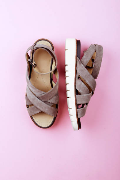 istock Summer Sandals on pastel backgrounds. 982042284