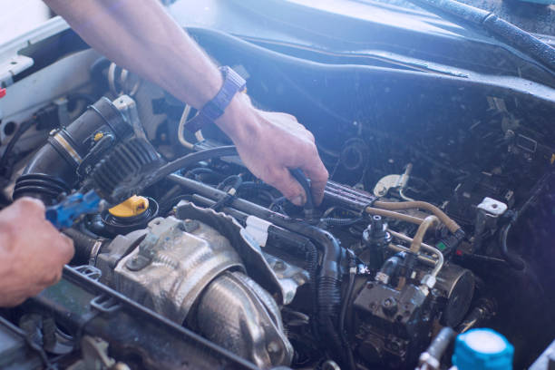 istock Auto mechanic repairing car. Selective focus. 982042324