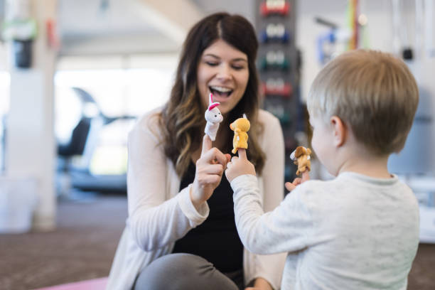 Physical therapist working with a young boy in the clinic