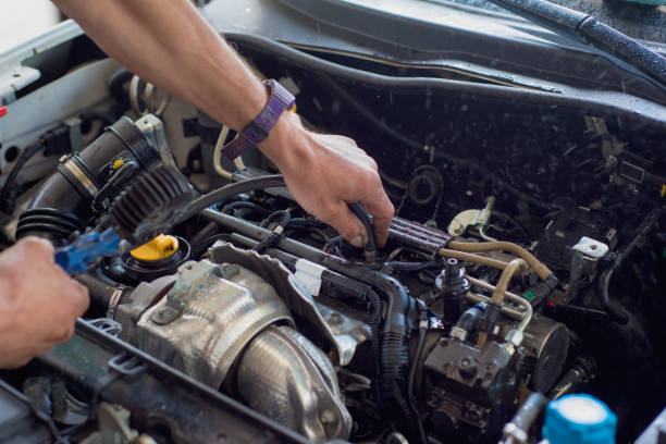 istock Auto mechanic repairing car. Selective focus. 982050250
