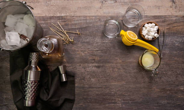 Whiskey sour cocktail garnished with orange and cherry.
