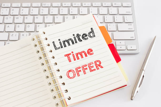 istock Word text Limited time offer on white paper on office table / business concept 982056250