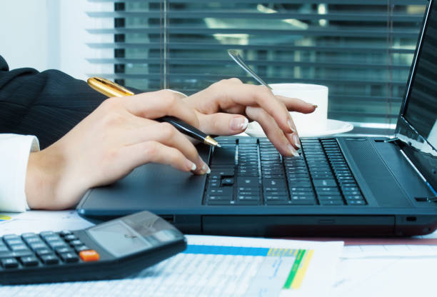 istock business woman at workplace with laptop 982061960