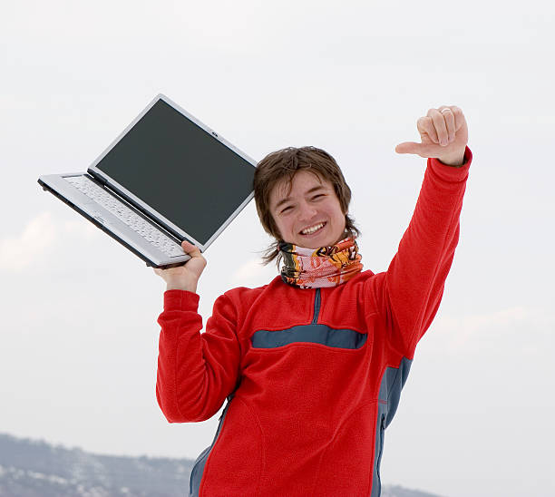 Casually-dressed 18-year-old girl with her laptop.