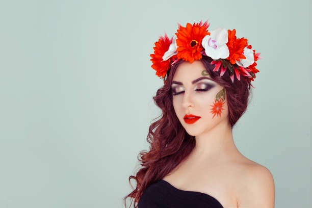 istock woman model with white red daisy flowers on head 982093654