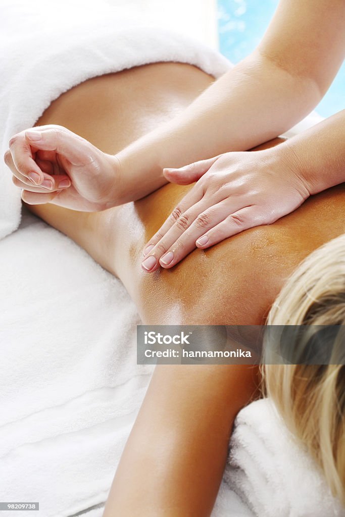 Young woman receiving professional massage  Massaging Stock Photo