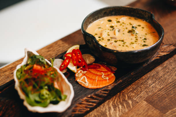 istock freshly cooked creamy mushroom soup in a dark clay dish 982101394