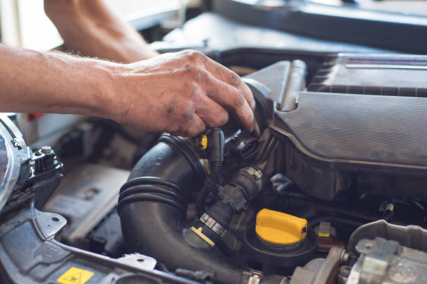 istock Auto mechanic repairing car. Selective focus. 982104320