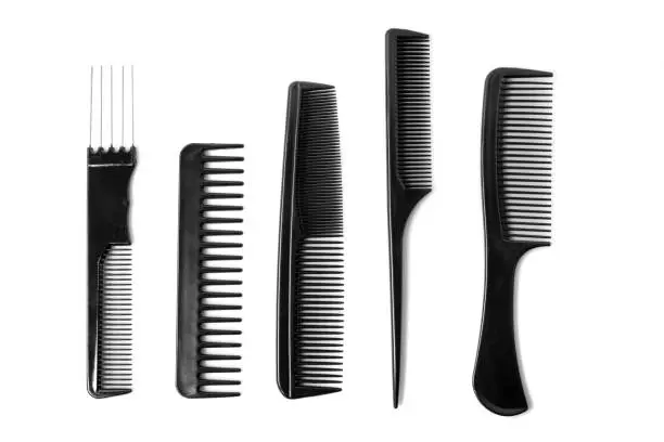 Multiple different combs arranged on a white background.