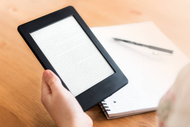 istock Girl is reading ebook on digital tablet device 982108188