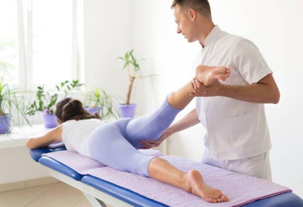 istock Young woman on physical therapy 982114138