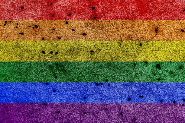 istock LGBTQ rainbow pride flag painted on grunge wall background 982114350