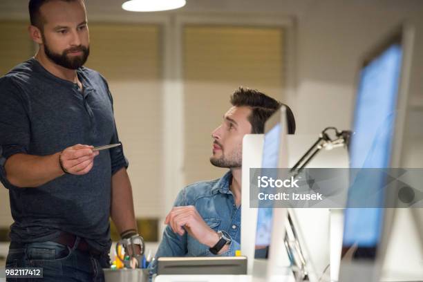 Two Man Working Together In Office Stock Photo - Download Image Now - Computer, Computer Programmer, Two People