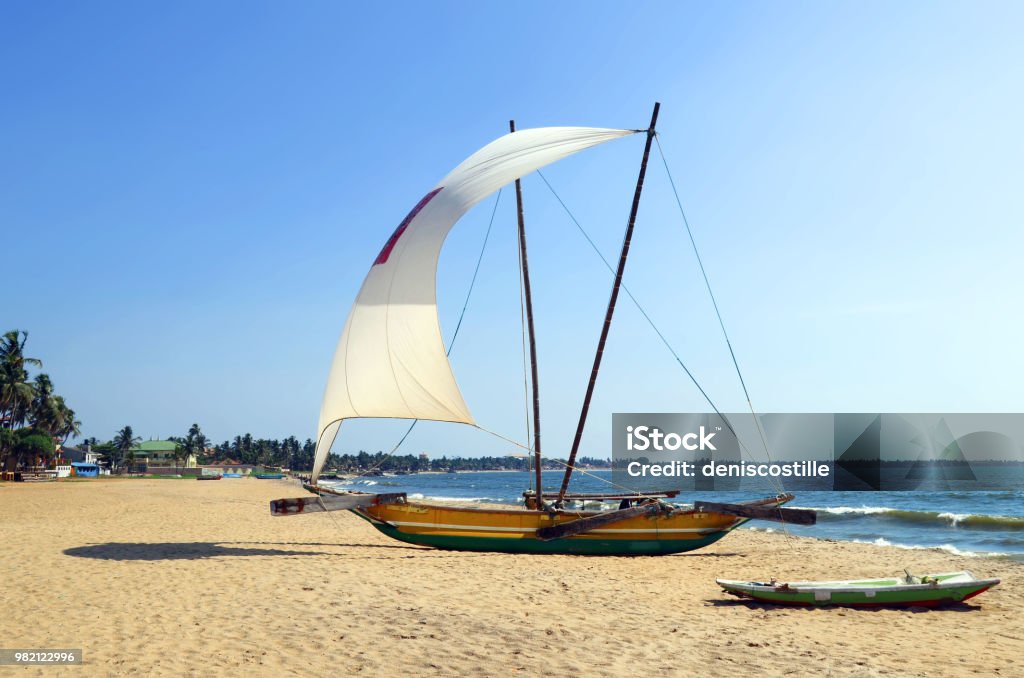 Traditional catamaran on Negombo beach Traditional catamaran on the beach of Negombo, Sri Lanka. Negombo Stock Photo