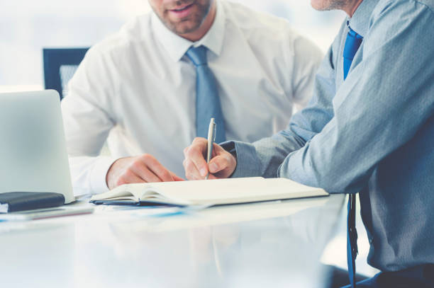 istock Two businessmen meeting with technology. 982128334