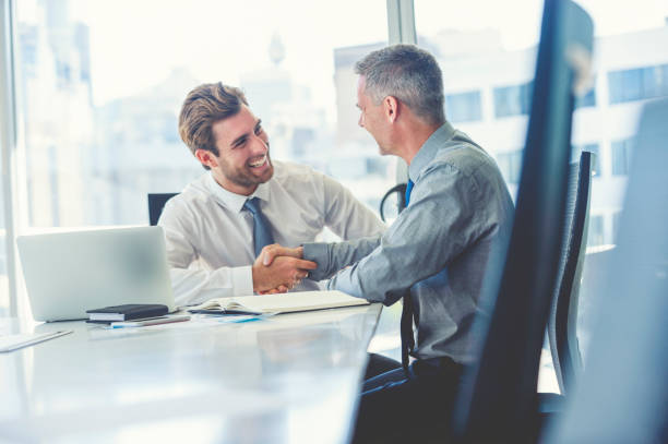 istock Two businessmen meeting with technology. 982128344