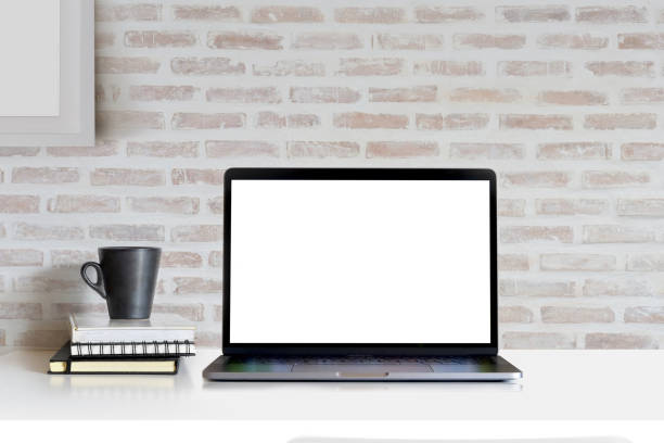 istock Mock Up workspace, Blank screen laptop and mockup poster at studio workplace. 982147912