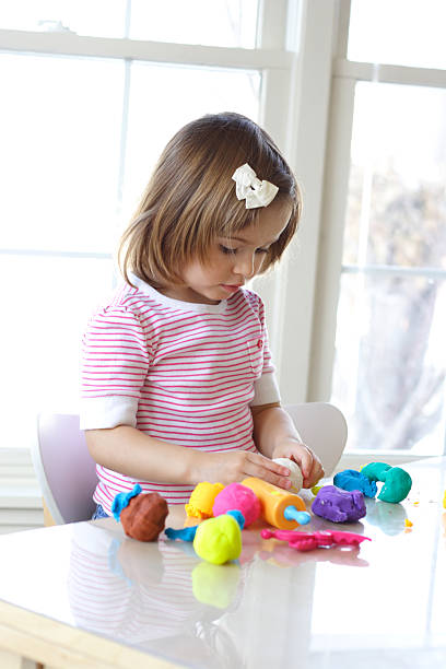 istock Girl playing with play dough 98215171