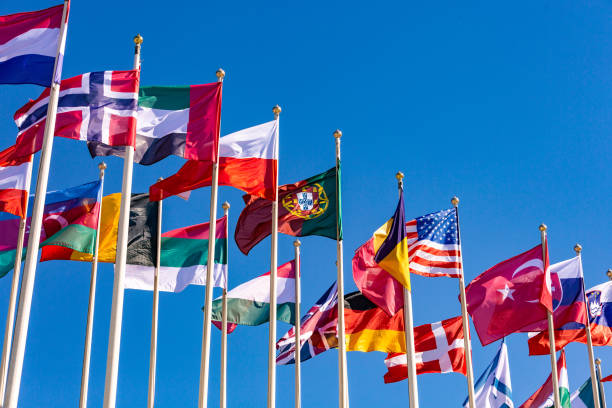 istock Flags of different countries flutters in the wind against 982152248