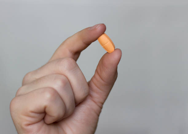 istock pill in a woman's hand. Medicine concept. Close-up. Selective focus 982152878