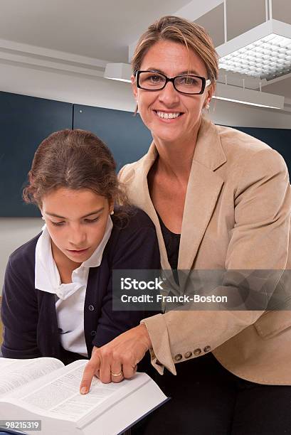 Teacher And Schoolgirl In Class Stock Photo - Download Image Now - Adult, Classroom, Color Image