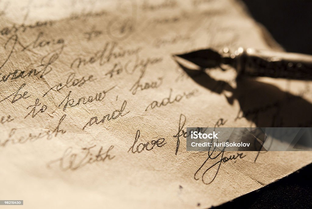 Old love letter Love letter and antique quill on a black background Antique Stock Photo