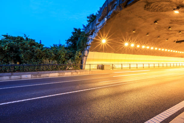 istock Urban highway tunnel at night 982163844