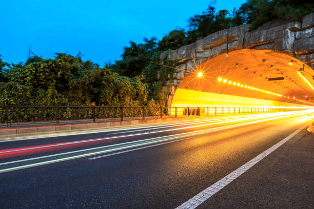 istock Urban highway tunnel at night 982183612