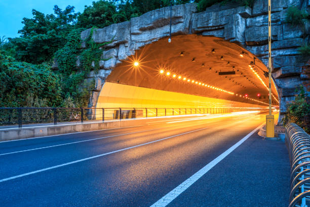 istock Urban highway tunnel at night 982186856