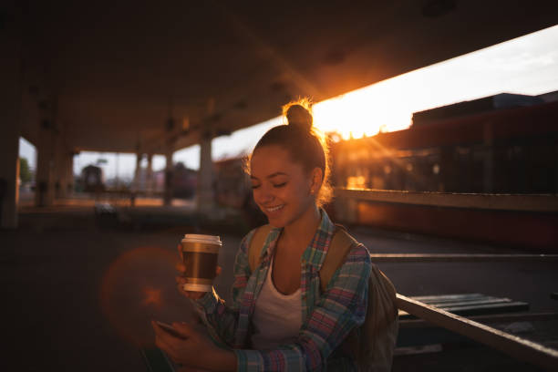 istock Surfing the net on train station 982186858