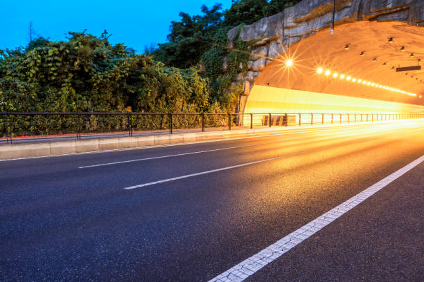 istock Urban highway tunnel at night 982189002